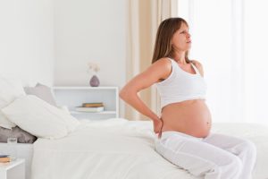 Почему болит поясница на 20 неделе беременности
